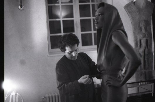 Azzedine adjusting Grace Jones in his studio before a private shoot. 