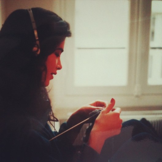 Linda, listening to her walkman, knitting between shows.