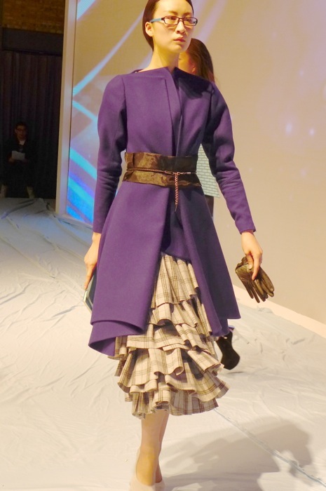 I loved how the student balanced the heavy ruffled skirt with the prim coat. 