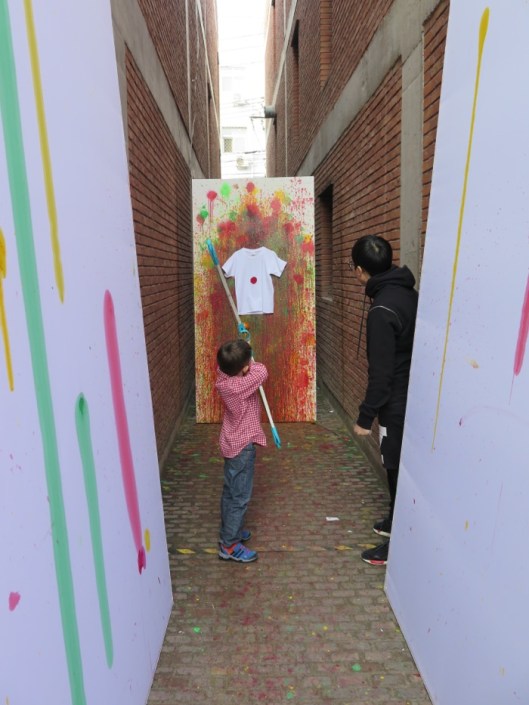 My kid designing his colored T-Shirt at the CAFA stand. 