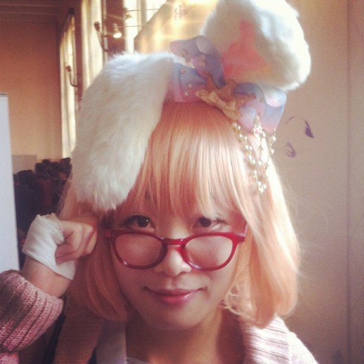 Belle du Jour in pink hair and fluffy ears. 